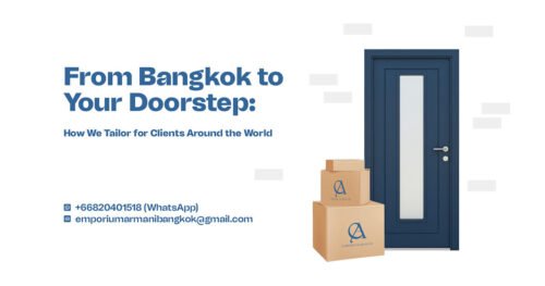 Emporium Armani delivery boxes stacked beside a navy blue door, symbolizing worldwide custom suit delivery from Bangkok.